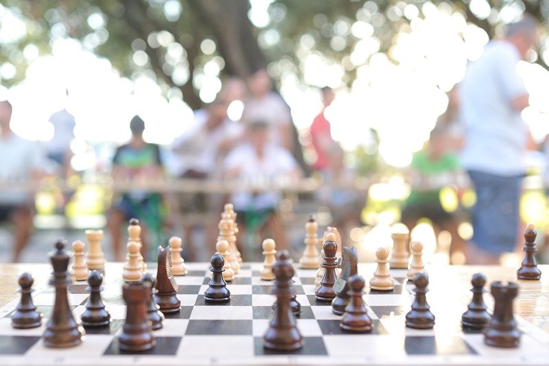 Illustration: A game of chess played outdoors in a park