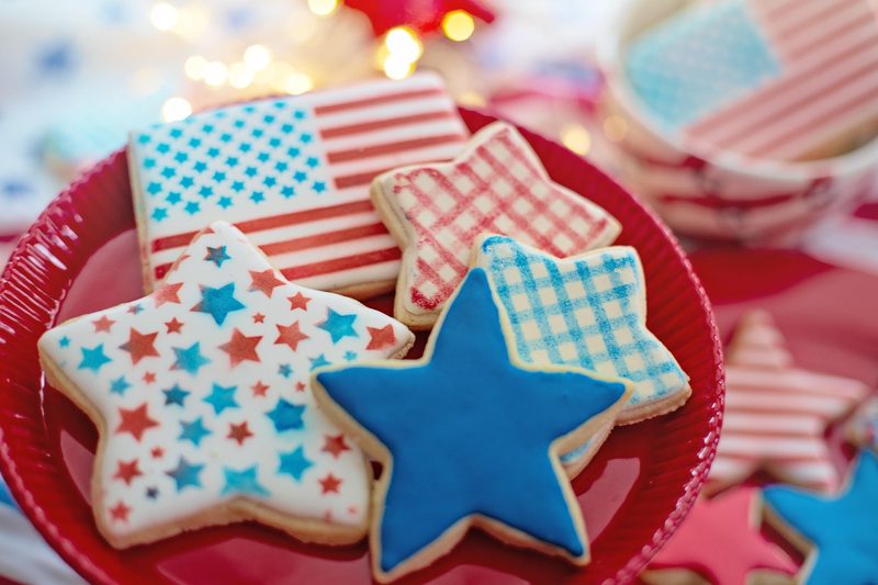 Illustration: American flag and star-shaped cookies on a red plate