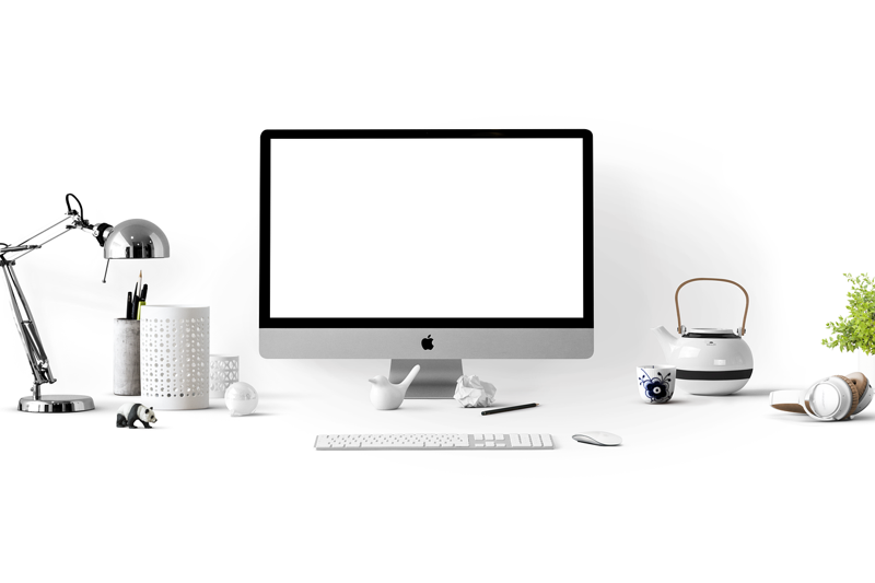Illustration: A computer desk with a desktop, lamp, teapot, and other objects