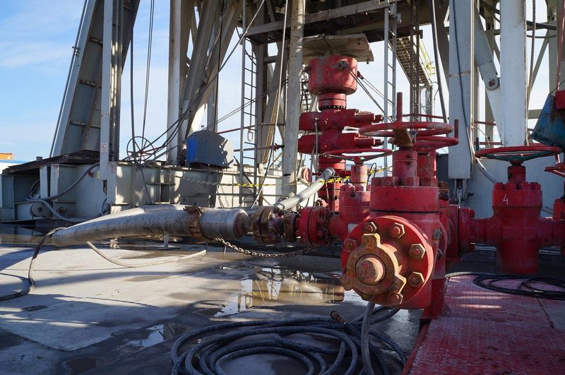 Illustration: Pipes, machinery and valves on an oil rig deck
