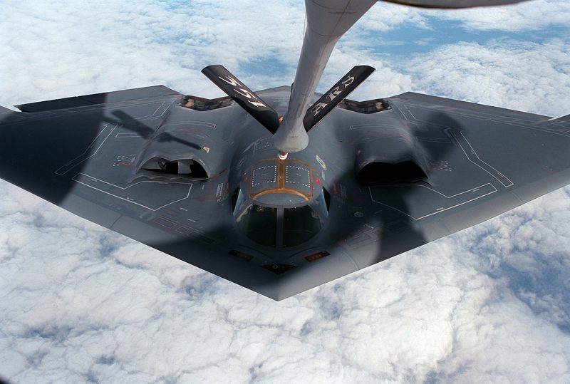 Illustration: A B 2 Spirit bomber flying above the clouds