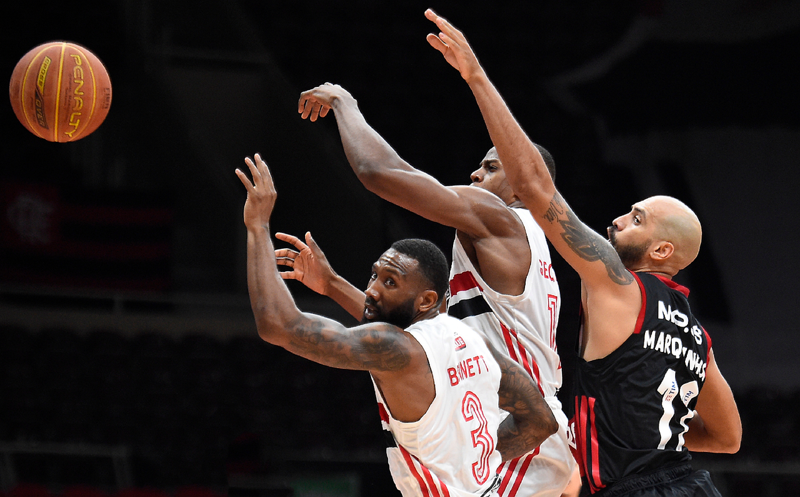 Illustration: Three basketball players playing a game indoors