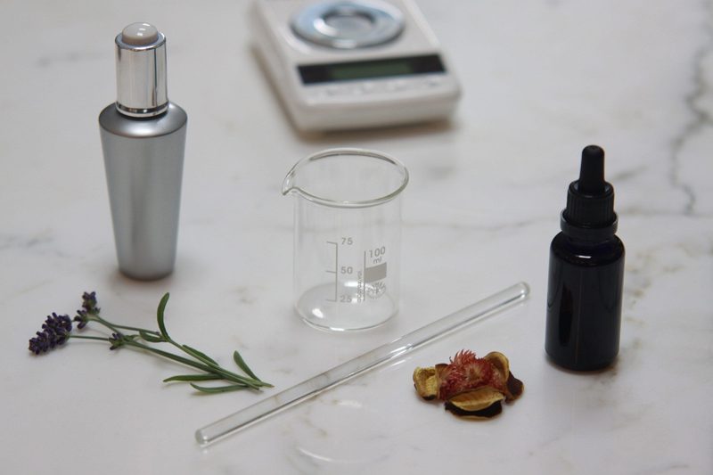 Illustration: Cosmetic ingredients including lavender and dried fruits on a white surface