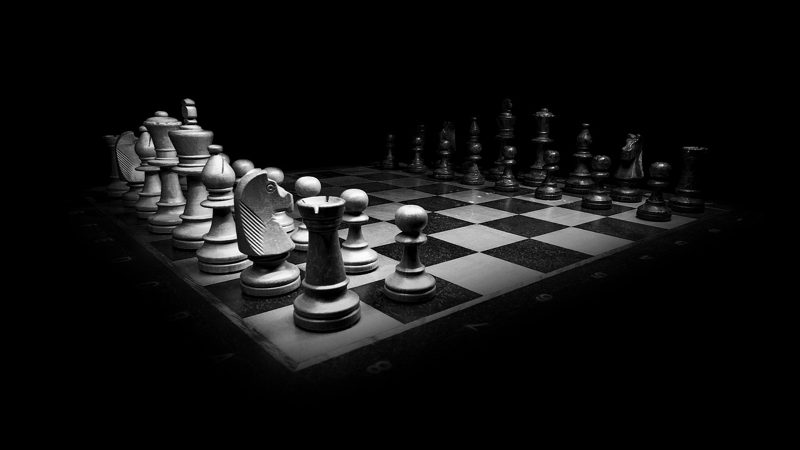 Illustration: A black and white chess board with pieces set up