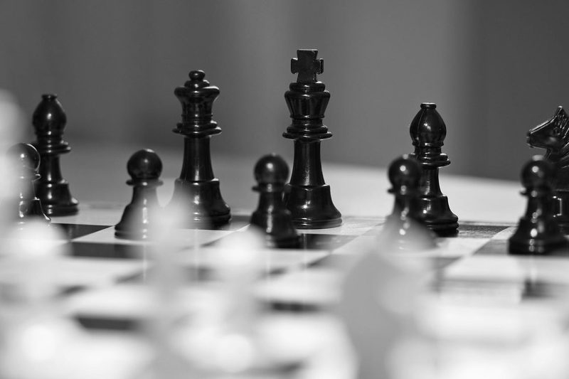 Illustration: A black and white photo of a chess game