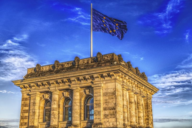 Illustration: The flag of Europe flying above the Reichstag building in Berlin