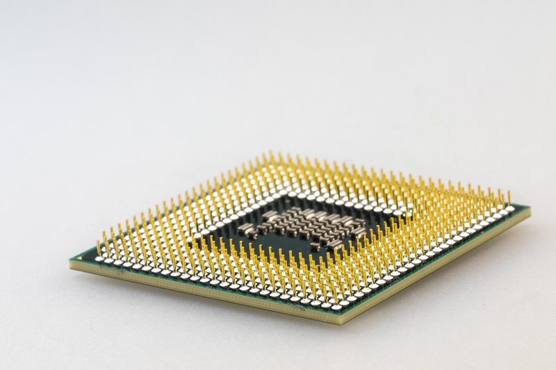 Illustration: A computer processor chip on a white surface