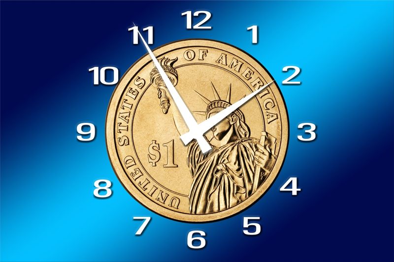 Illustration: A clock face shaped like a coin with a blue background