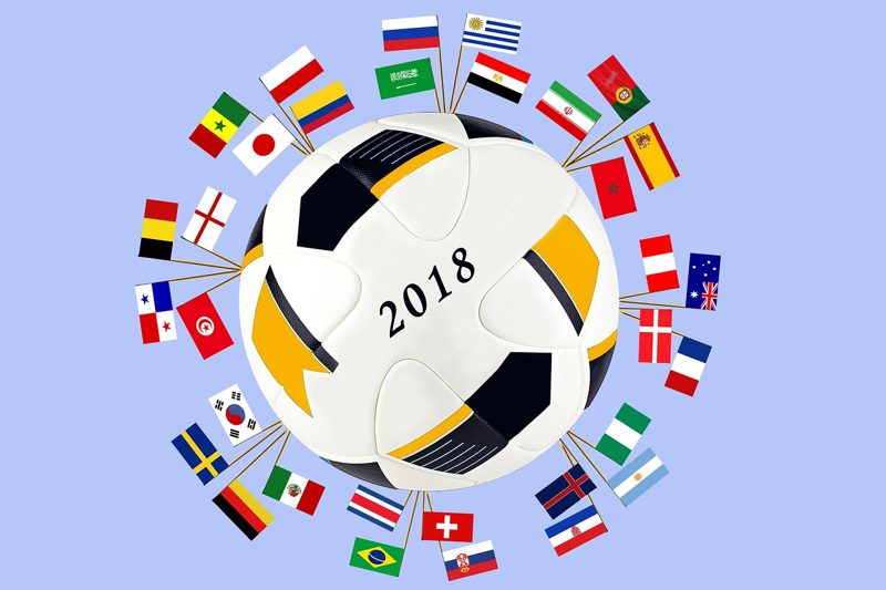 Illustration: A football with the year 2018 surrounded by flags