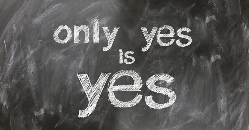 Illustration: The phrase "only yes is yes" written in chalk on a blackboard