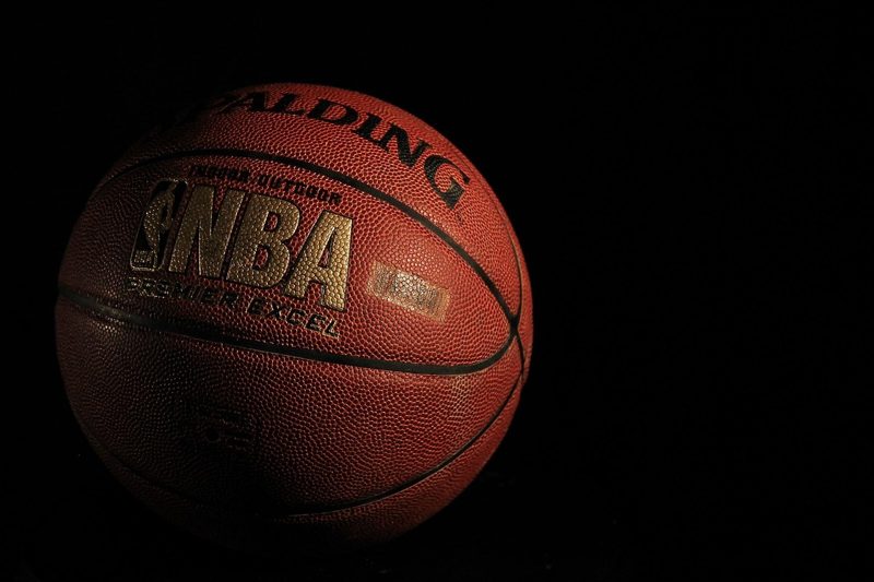 Illustration: A basketball with the NBA and Spalding logo on a black background