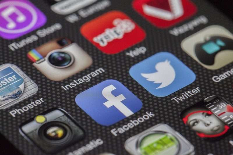 Illustration: Various app icons displayed on a smartphone screen