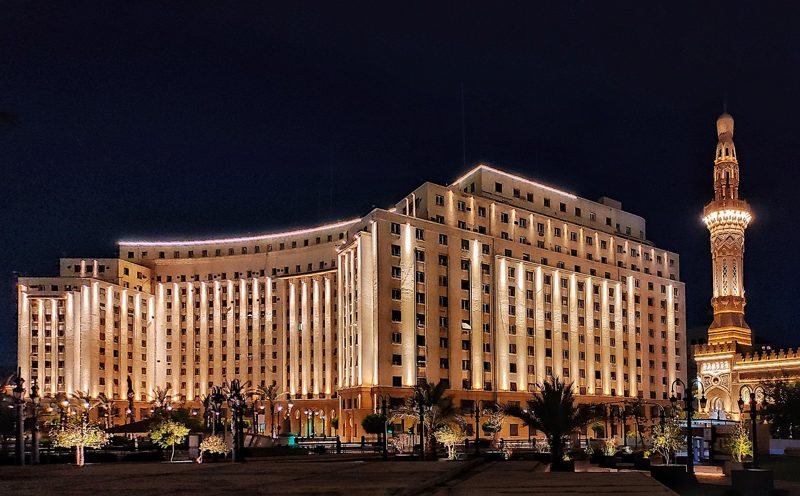 Illustration: The Mogamma building in Cairo illuminated at night
