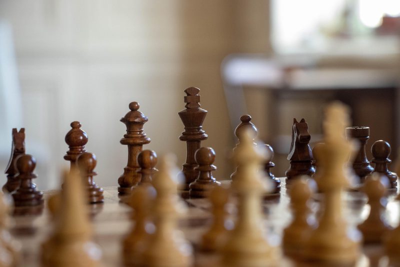 Illustration: A close-up of a chess board with pieces