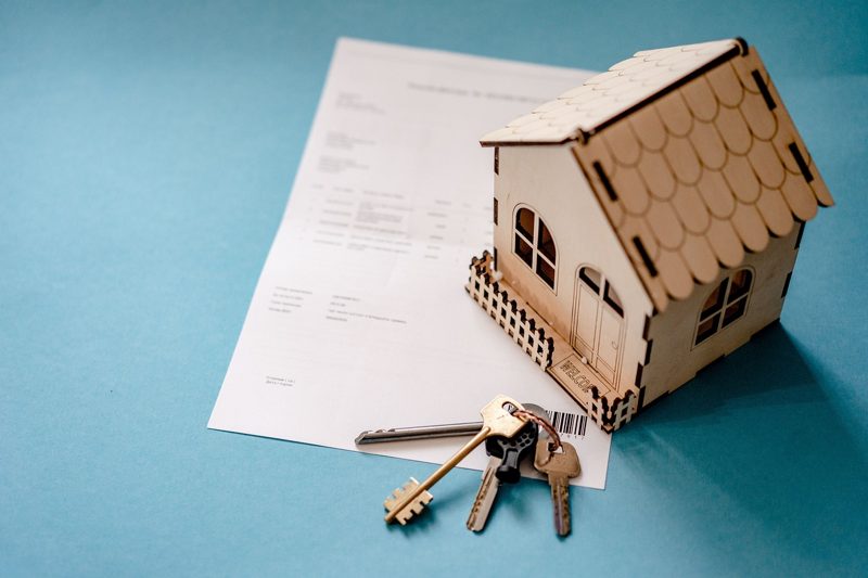 Illustration: Keys and a model house on a document