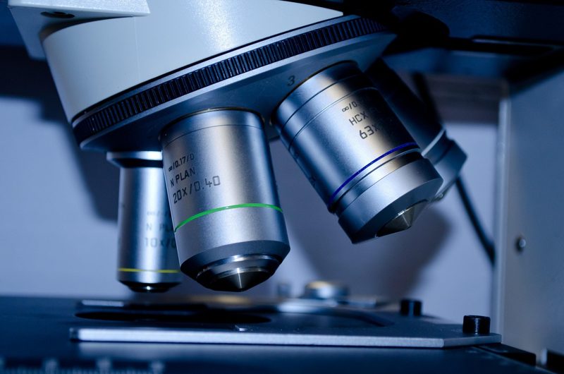 Illustration: A close up view of a microscope lenses