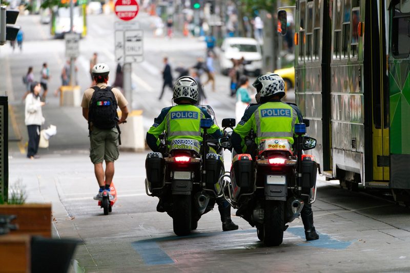 Illustration: Two police officers on motorbikes on a street